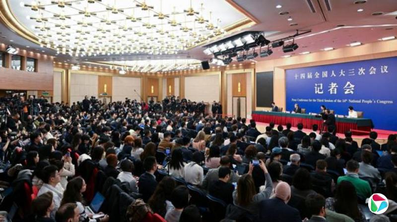 China's Foreign Minister Wang Yi (podium, 2nd L) speaks at a press conference during the ongoing National People's Congress (NPC) in Beijing on March 7, 2025